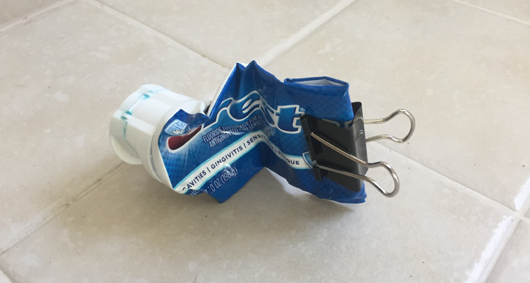 binder clip on toothpaste tube